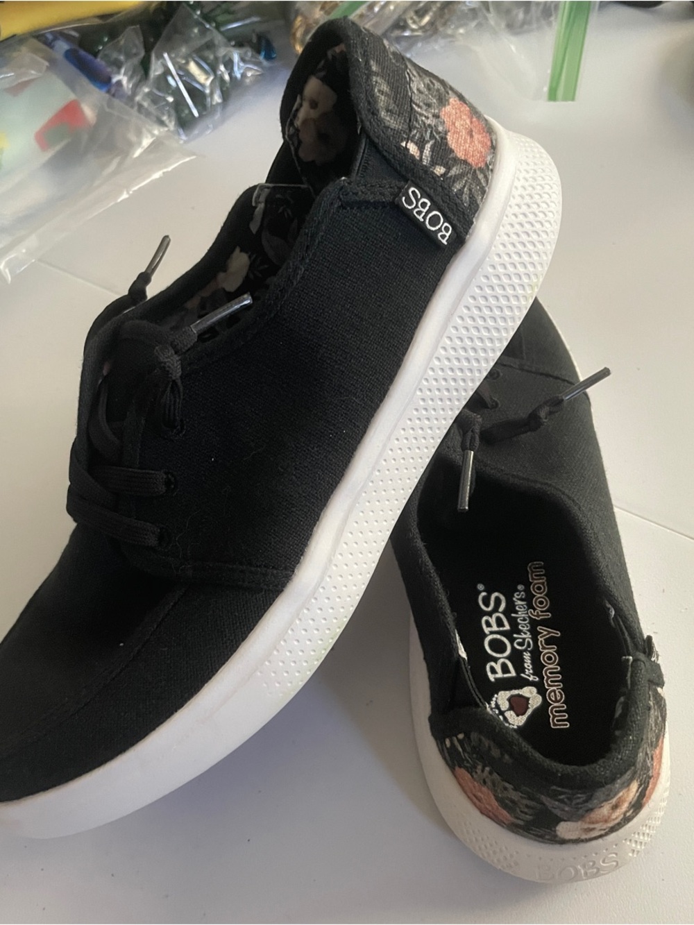 Skechers Black Canvas Slip-On Sneakers with Floral Heel Detail